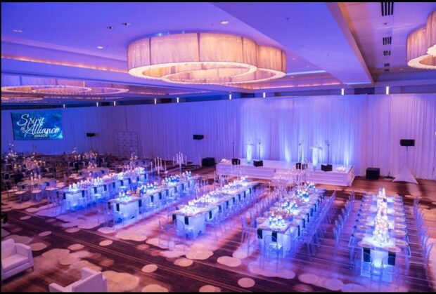Full-stage-and-wedding-setup-with-tables-and-chairs