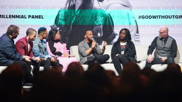 Millennial Panel at End Your Year Strong Summit with stage lighting and full audience
